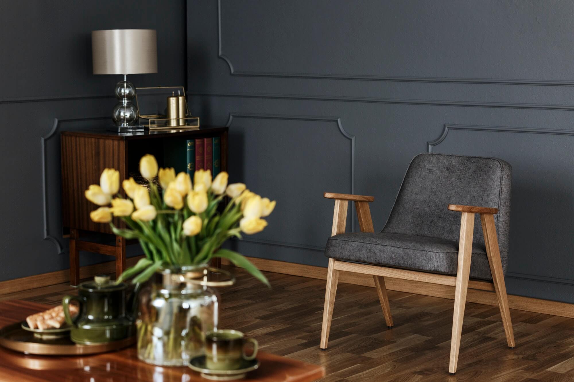 real-photo-of-a-retro-gray-armchair-and-wooden-cabinet-against-a.jpg